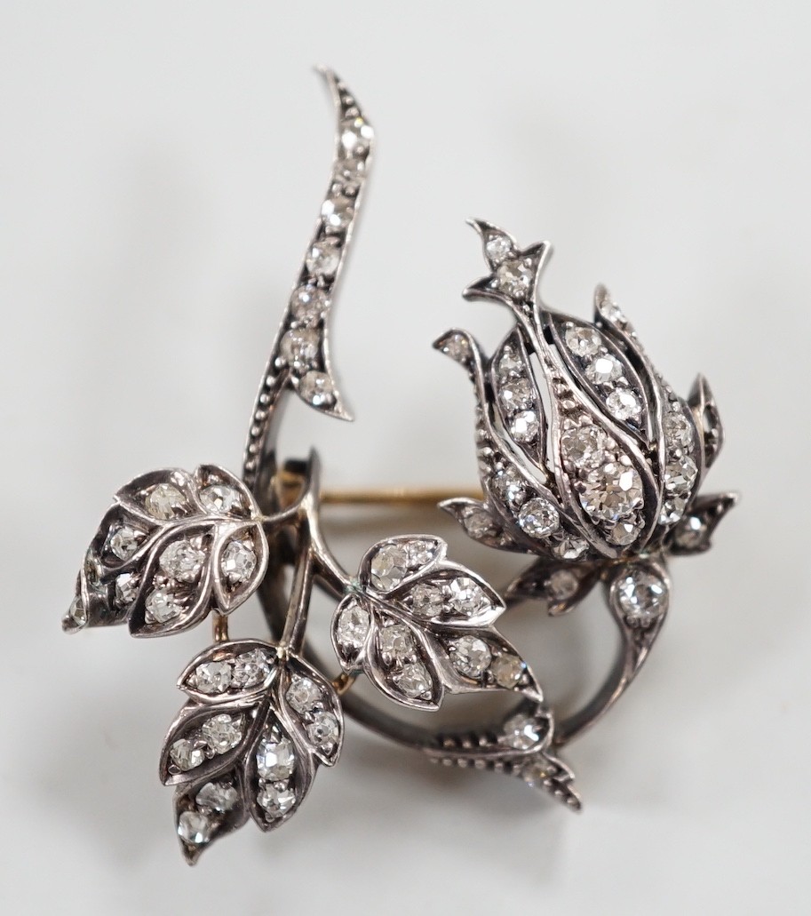 A Victorian yellow and white metal and diamond cluster set spray brooch, 38mm, gross weight 8.9 grams.